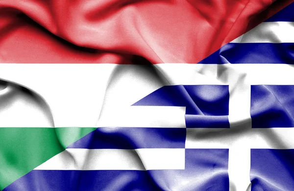 Waving flag of Greece and Hungary — Stock Photo, Image