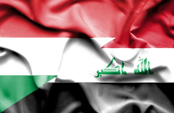 Waving flag of Iraq and Hungary — Stock Photo, Image