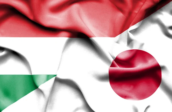 Bandiera sventolante di Giappone e Ungheria — Foto Stock