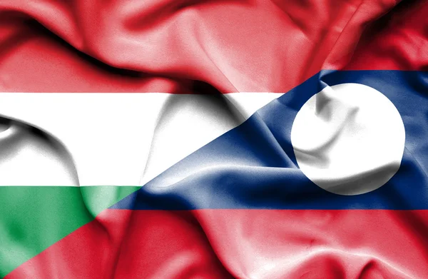Bandeira acenando de Laos e Hungria — Fotografia de Stock
