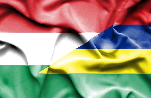 Flagge von Mauritius und Ungarn geschwenkt — Stockfoto