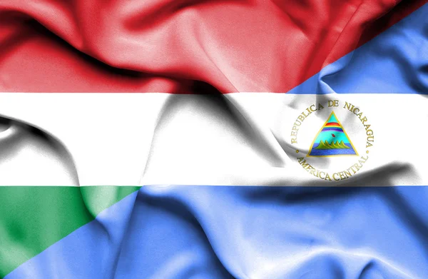 Waving flag of Nicaragua and Hungary — Stock Photo, Image