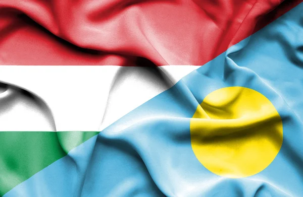 Mávání vlajkou Palau a Maďarsko — Stock fotografie
