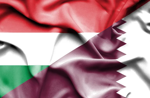 Waving flag of Qatar and Hungary — Stock Photo, Image
