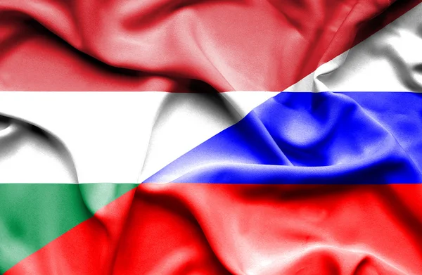 Waving flag of Russia and Hungary — Stock Photo, Image