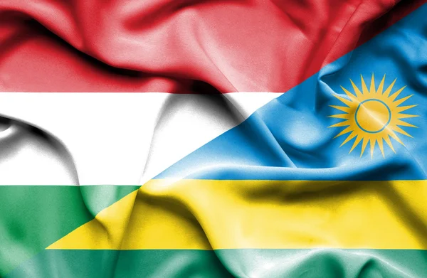 Flagge Ruandas und Ungarns schwenken — Stockfoto