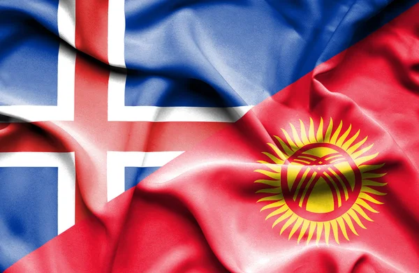 Kırgızistan ve İzlanda bayrağı sallayarak — Stok fotoğraf