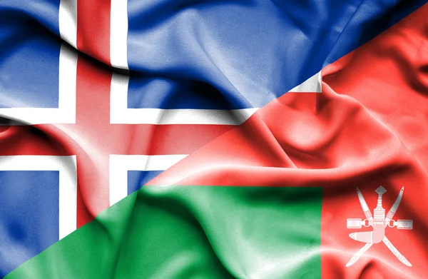 Viftande flagga Oman och Island — Stockfoto