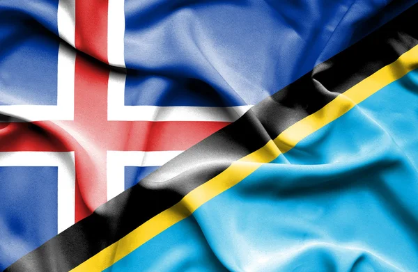 Tanzanya ve İzlanda bayrağı sallayarak — Stok fotoğraf