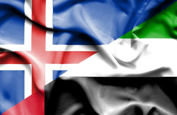 Vlající vlajka Spojených arabských emirátů a Islandu — Stock fotografie