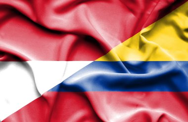 Columbia ve Endonezya bayrağı sallayarak