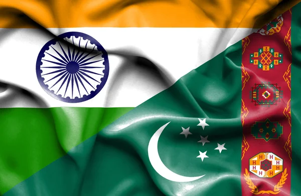Wapperende vlag van Turkmenistan en India — Stockfoto
