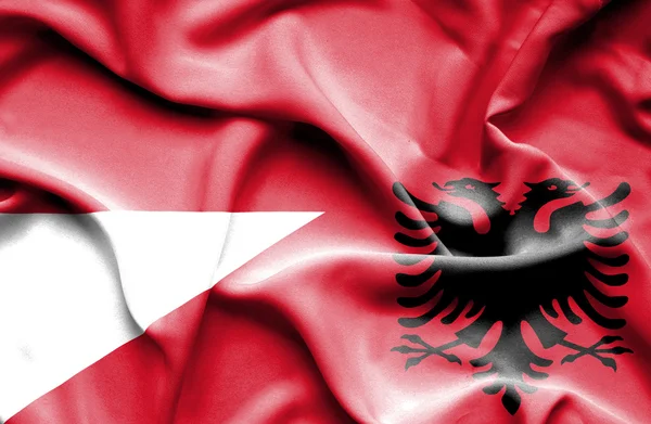 Vlající vlajka Albánie a Indonésie — Stock fotografie