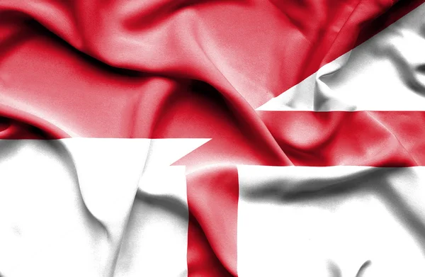Ondeando la bandera de Inglaterra e Indonesia — Foto de Stock