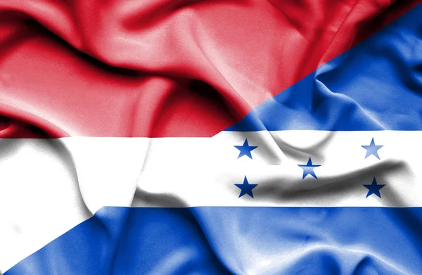 Waving flag of Honduras and Indonesia — Stock Photo, Image