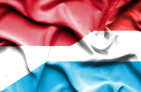 Flagge Luxemburgs und Indonesiens schwenken — Stockfoto