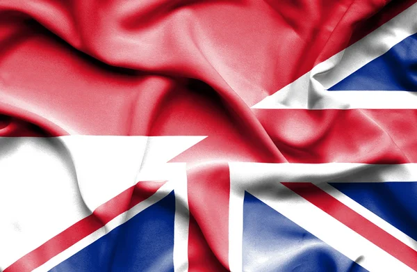 Bandeira ondulada do Reino Unido e da Indonésia — Fotografia de Stock