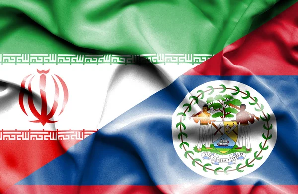 Wapperende vlag van Belize en Iran — Stockfoto