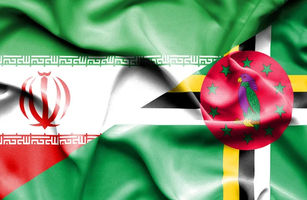 Macha flagą Dominika i Iran — Zdjęcie stockowe