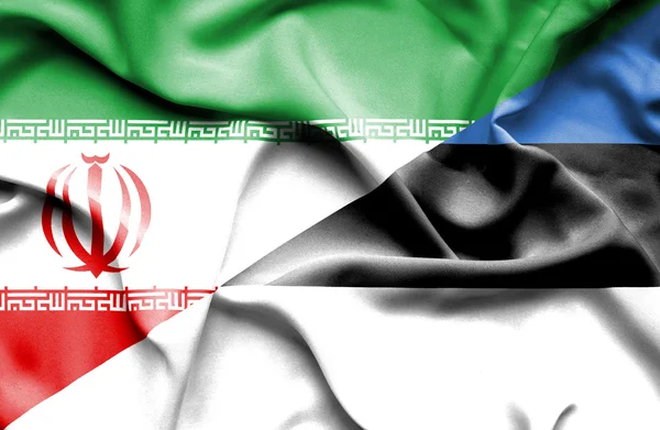 Macha flagą Estonii i Iran — Zdjęcie stockowe