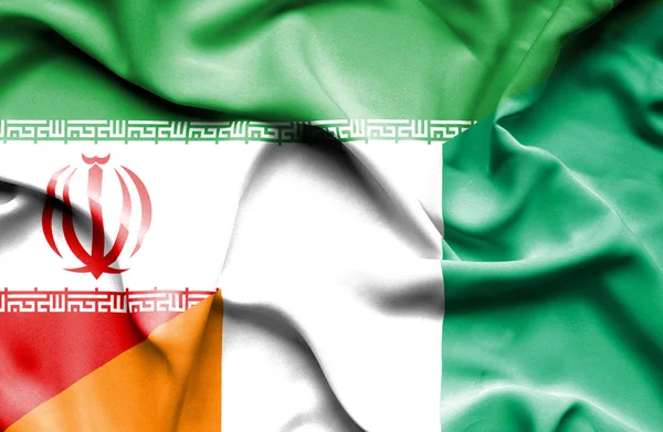 Mávání vlajkou Pobřeží slonoviny a Íránu — Stock fotografie
