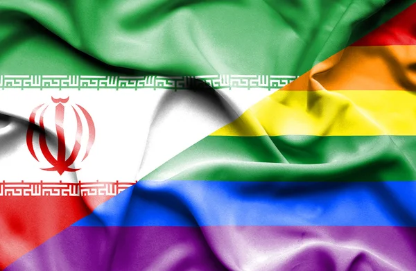 Macha flagą Lgbt i Iran — Zdjęcie stockowe