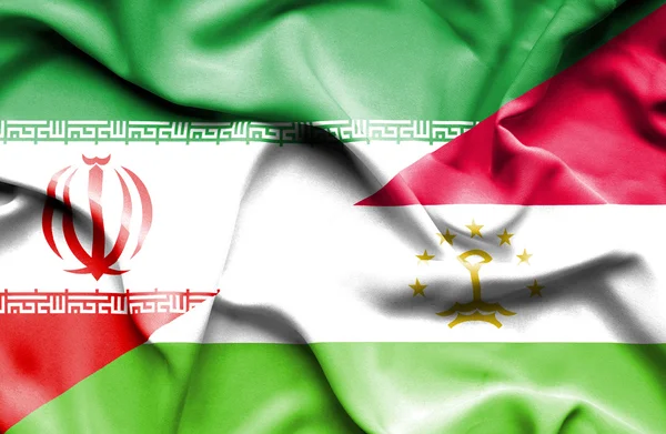 Flagge des Iran und Tadschikistan winken — Stockfoto