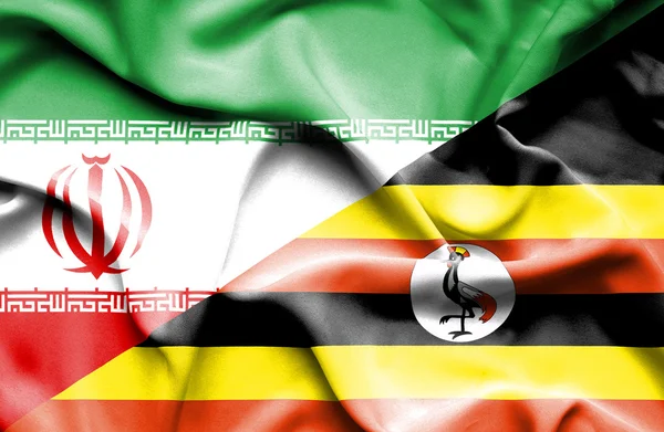 Uganda och Iran viftande flagga — Stockfoto