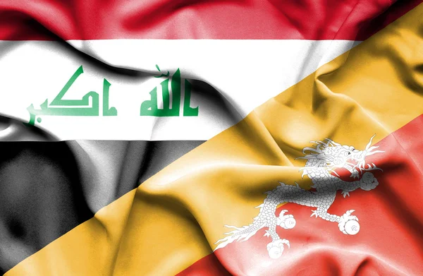 Flagge von Bhutan und Irak schwenken — Stockfoto