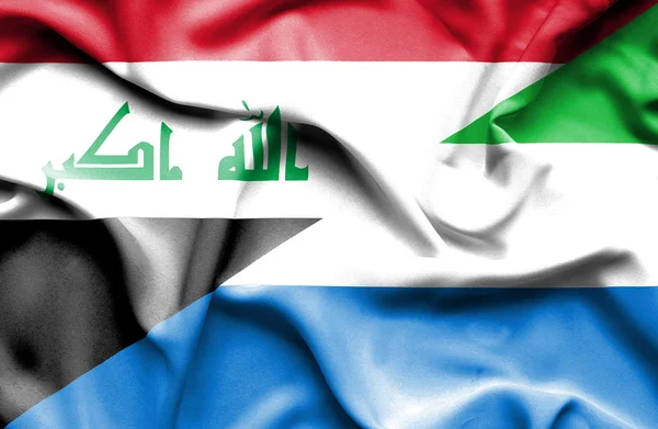 Flagge von Sierra Leone und Irak geschwenkt — Stockfoto