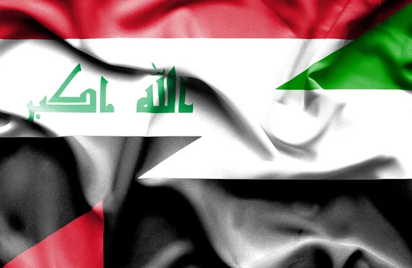 Κουνώντας τη σημαία των Ηνωμένων Αραβικών Εμιράτων και Ιράκ — Φωτογραφία Αρχείου