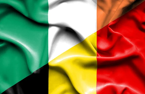 Waving flag of Belgium and Ireland — Stock Photo, Image