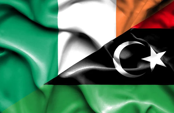 Waving flag of Libya and Ireland — Stock Photo, Image