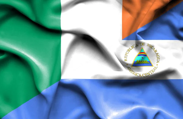 Waving flag Nicaragua og Irland - Stock-foto