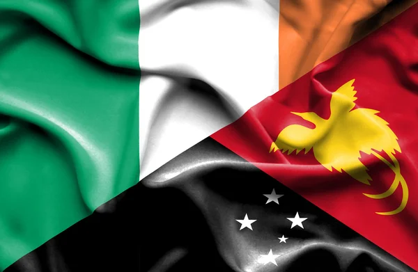 Wapperende vlag van Papoea-Nieuw-Guinea en Ierland — Stockfoto
