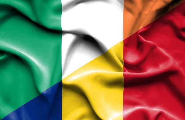 Waving flag of Romania and Ireland — Stock Photo, Image