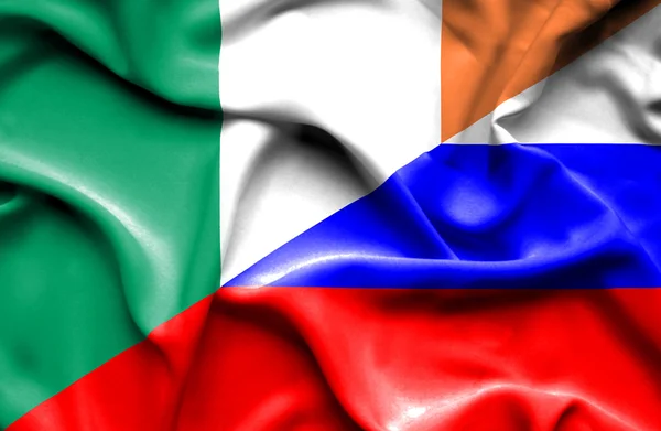 Rusya ve İrlanda bayrağı sallayarak — Stok fotoğraf