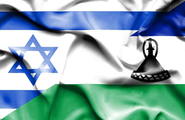 Ondeando la bandera de Lesotho e Israel — Foto de Stock