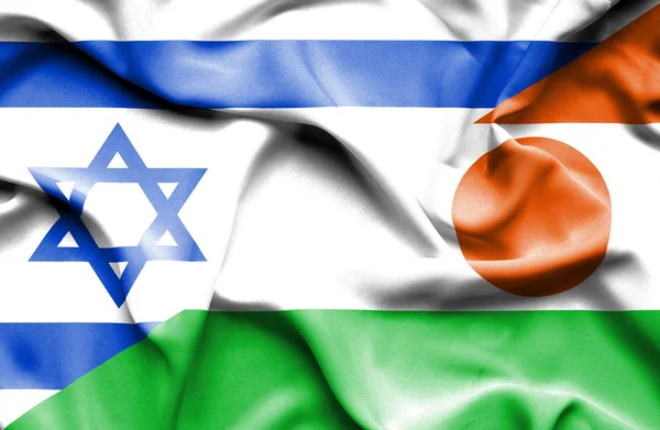 Lambaikan bendera Niger dan Israel — Stok Foto