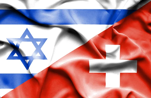 Lambaikan bendera Swiss dan Israel — Stok Foto