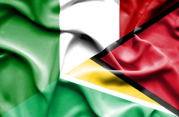 Waving flag of Guyana and Italy — Stock Photo, Image