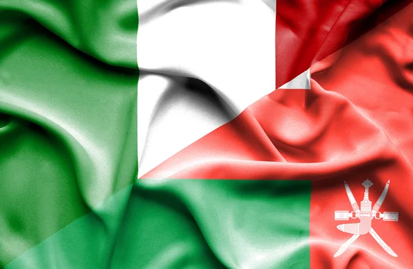 Bandera ondeante de Omán e Italia —  Fotos de Stock
