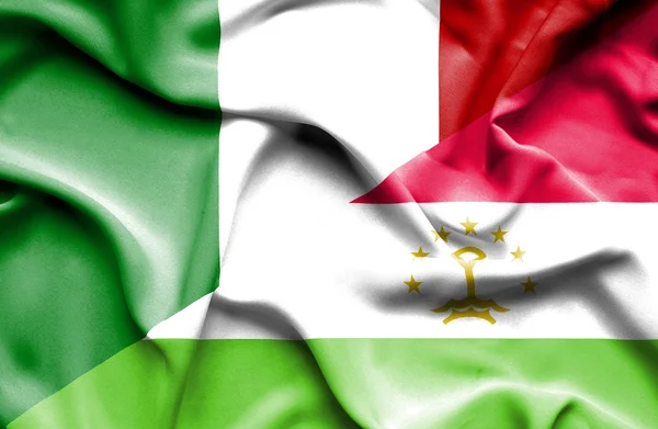 Flagge von Tadschikistan und Italien schwenken — Stockfoto