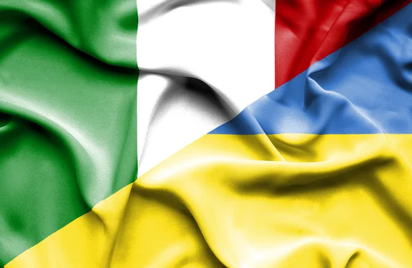 Waving flag of Ukraine and Italy — Stock Photo, Image