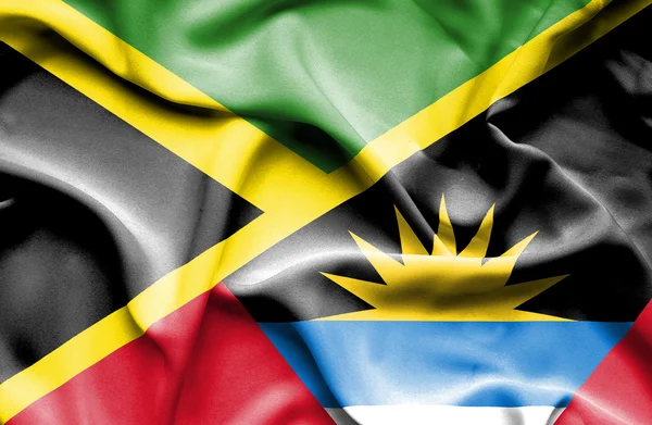 Flagge von Antigua und Barbuda und Jamaica schwenken — Stockfoto