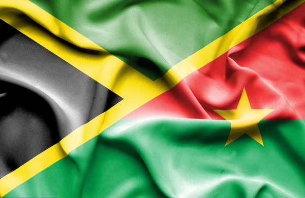 Wapperende vlag van Burkina Faso en Jamaica — Stockfoto