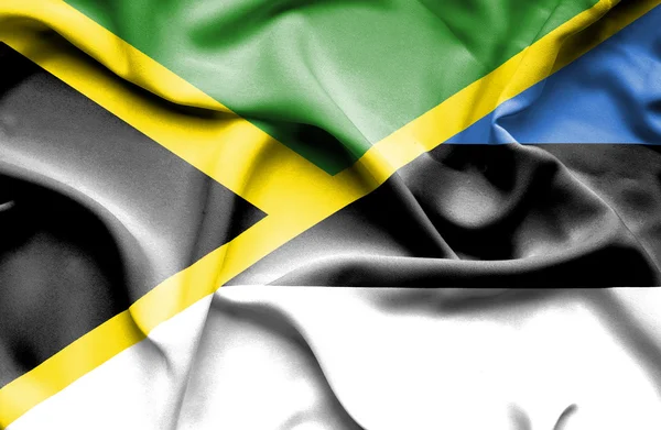 Bandera ondeante de Estonia y Jamaica —  Fotos de Stock