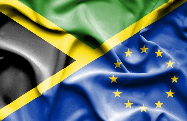Mávání vlajkou Evropské unie a Jamajka — Stock fotografie