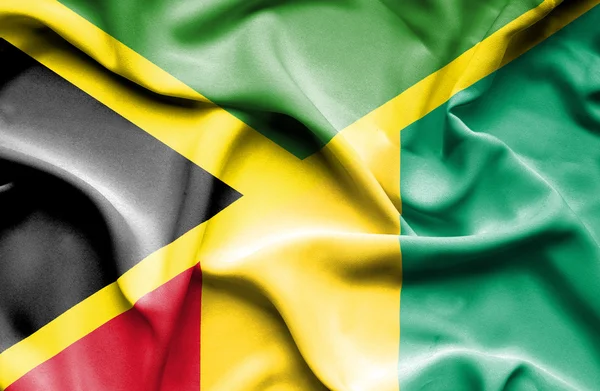 Waving flag of Guinea and Jamaica — Stock Photo, Image