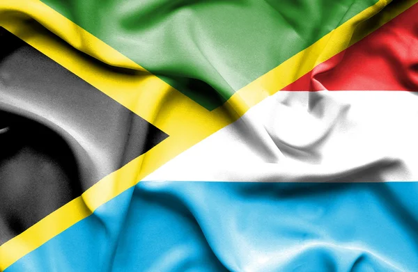 Bandeira ondulada de Luxemburgo e Jamaica — Fotografia de Stock